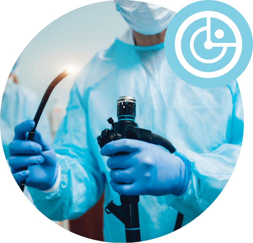 Doctor Holding Endoscope | The George Centre