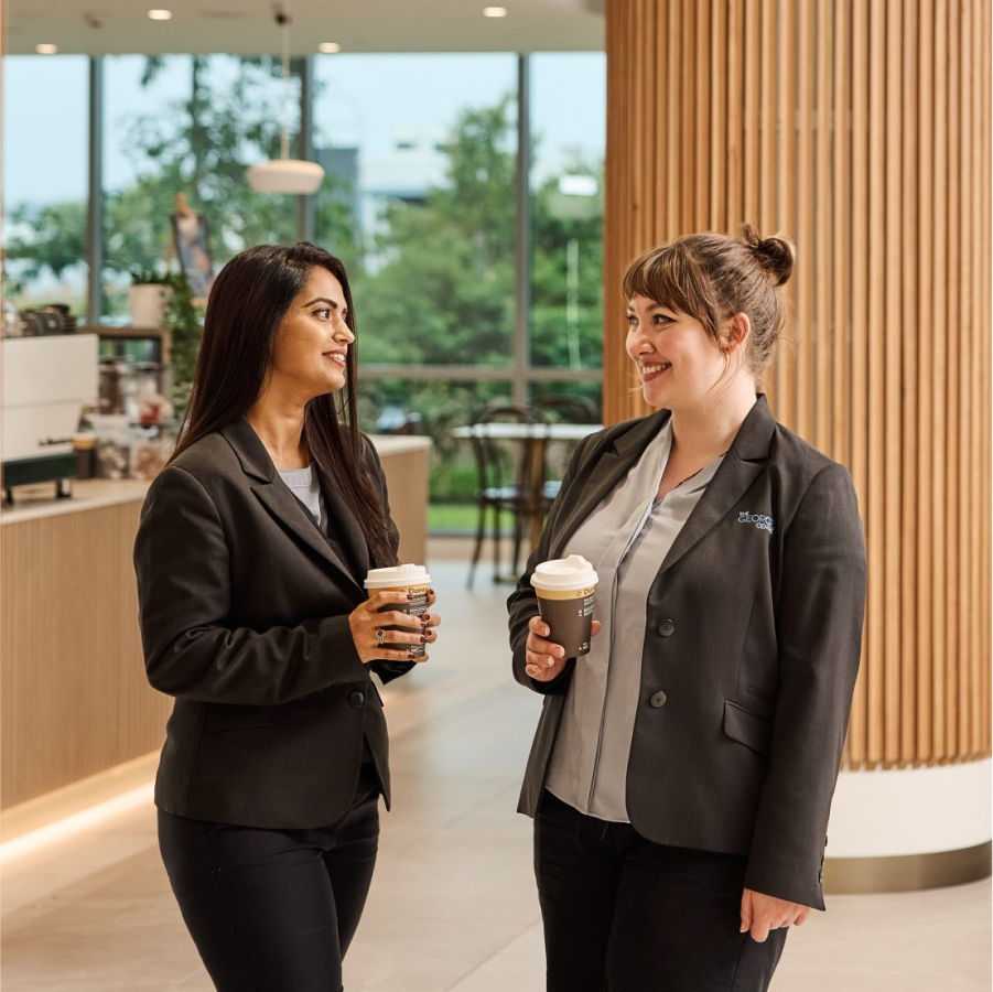 two-girls-in-foyer-with-cups